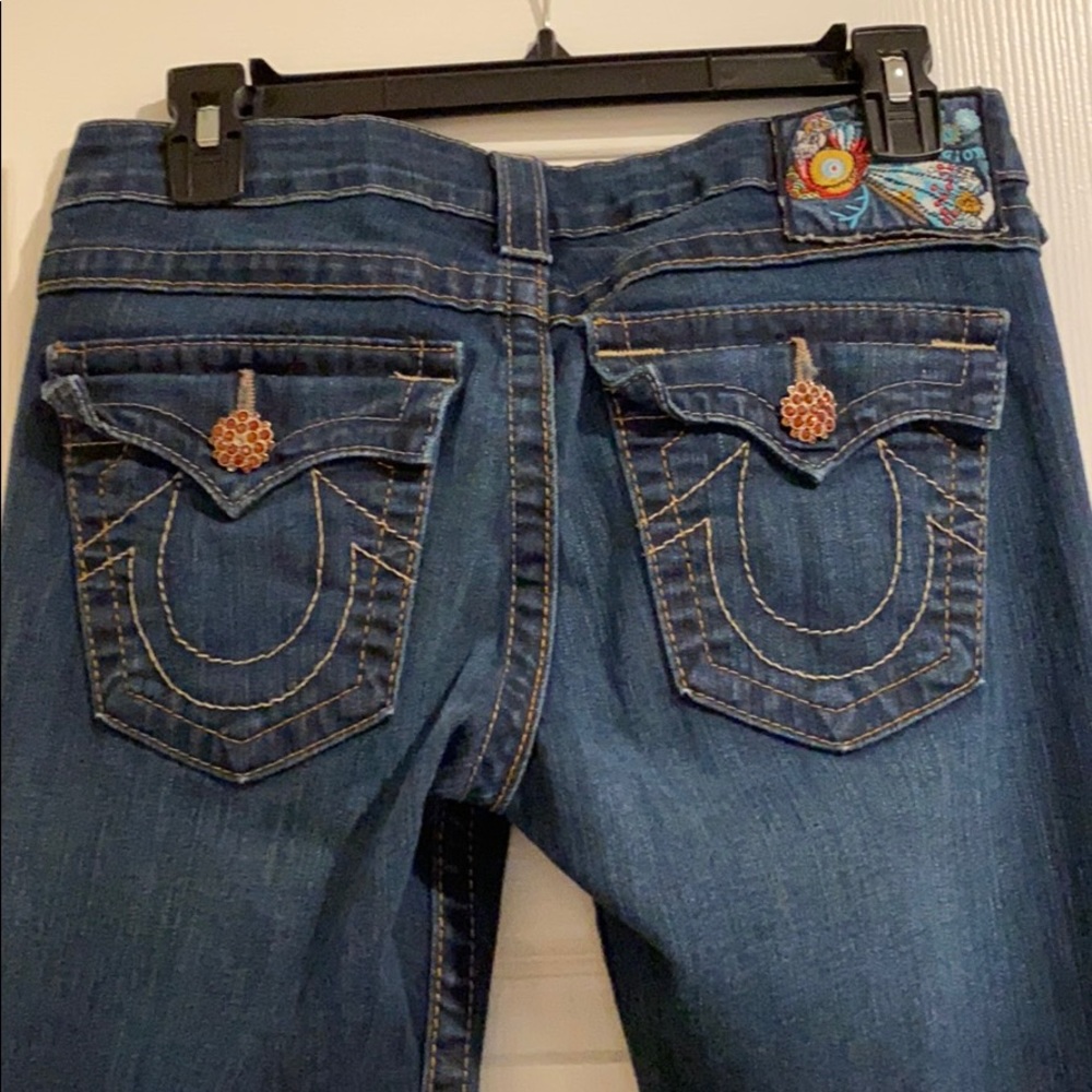 Women’s low rise boot cut True Religion jeans.